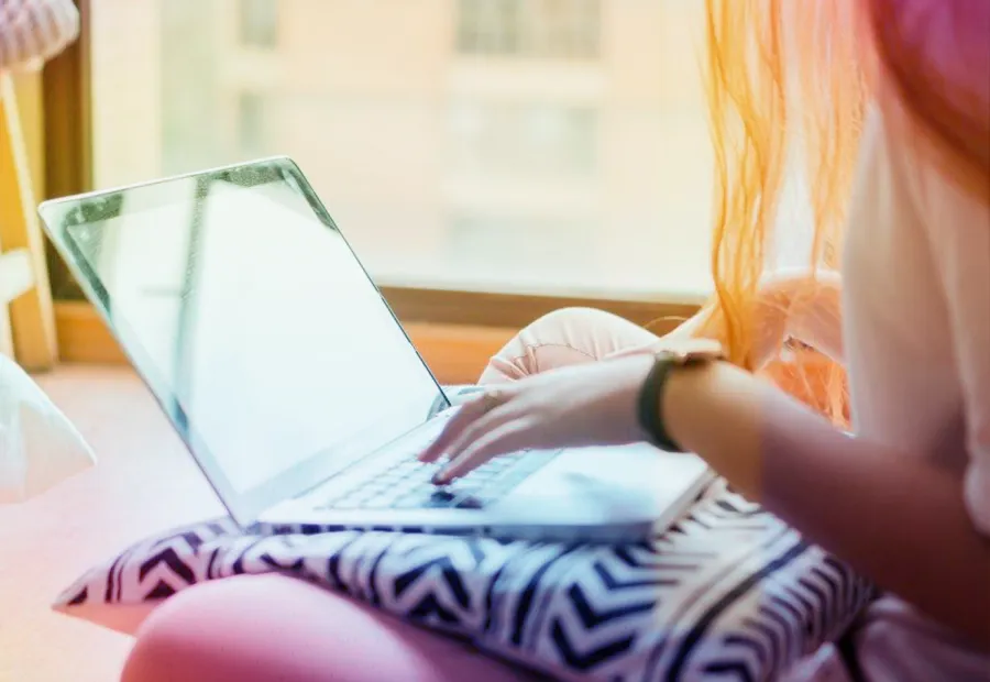 young person looking at laptop